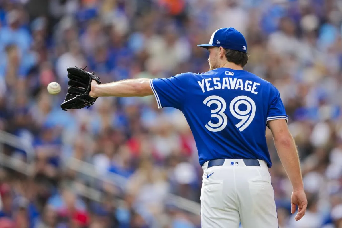 Toronto Blue Jays pitcher Trey Yesavage (39) catches the ball before pitching against the Tampa Bay Rays during the fifth inning at Rogers Centre.