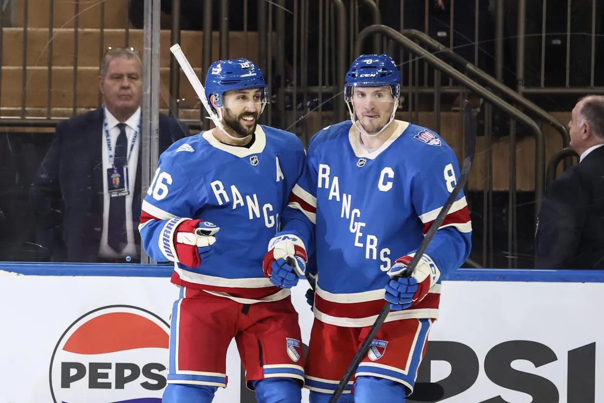New York Rangers center Vincent Trocheck (16) celebrates with center J.T. Miller (8) after scoring a goal in the third period against the Buffalo Sabres at Madison Square Garden.