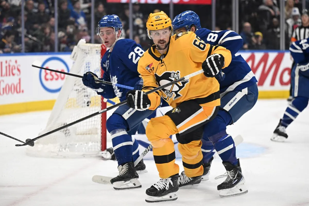 Pittsburgh Penguins defenseman Erik Karlsson (65) pursues the play against the Toronto Maple Leafs in the second period at Scotiabank Arena.