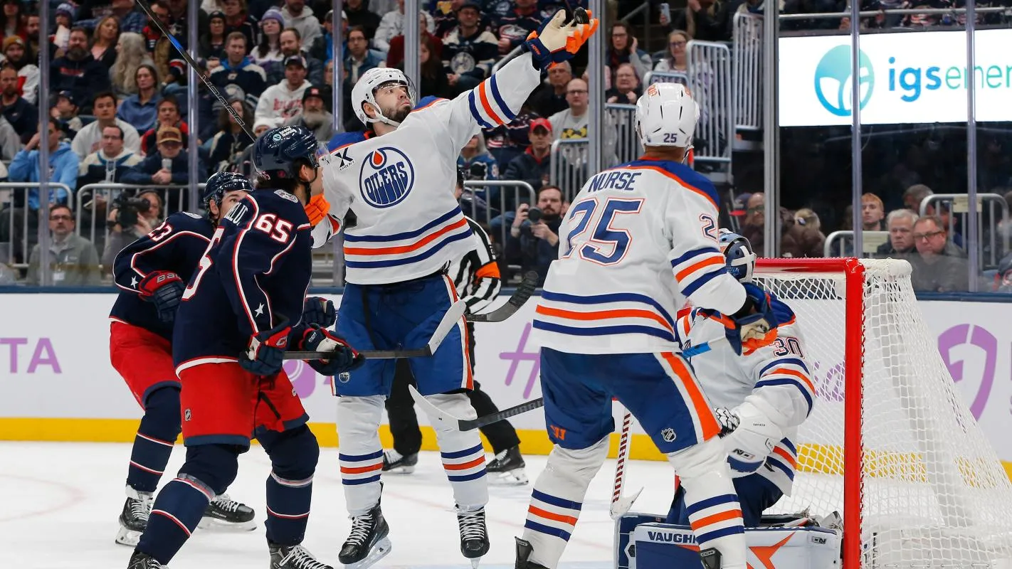 Edmonton Oilers defenseman Jake Walman (96) bats the puck away after a save by Calvin Pickard (30) against the Columbus Blue Jackets during the second period at Nationwide Arena.