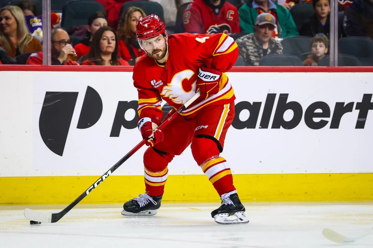 Calgary Flames defenseman Rasmus Andersson (4) controls the puck against the Nashville Predators during the second period at Scotiabank Saddledome.