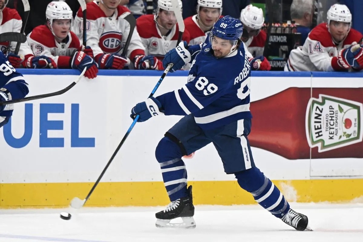 Toronto Maple Leafs forward Nick Robertson (89) shoots the puck against the Montreal Canadiens in the first period at Scotiabank Arena.