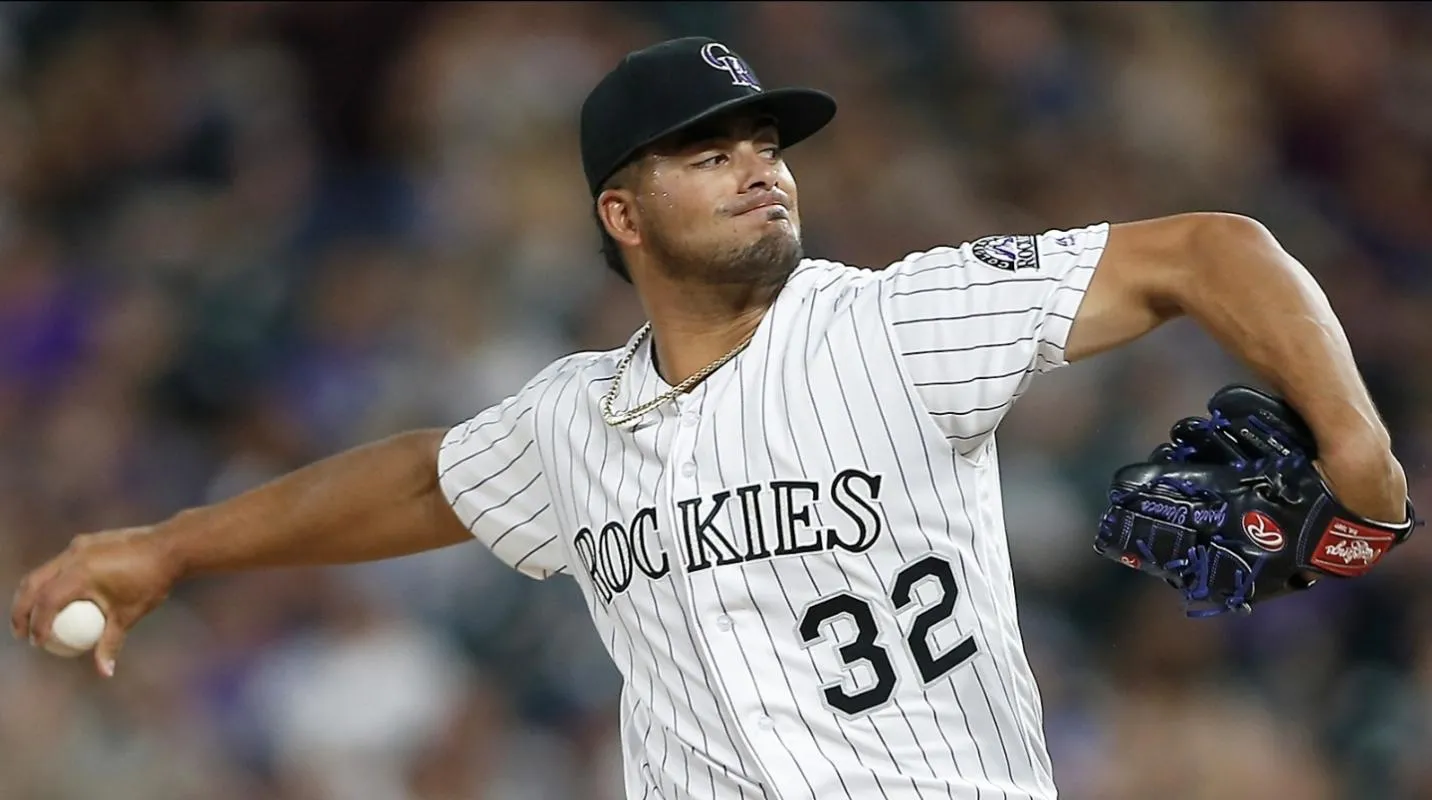 Colorado Rockies relief pitcher Jesus Tinoco (32) delivers a pitch in the fifth inning against the Pittsburgh Pirates at Coors Field.