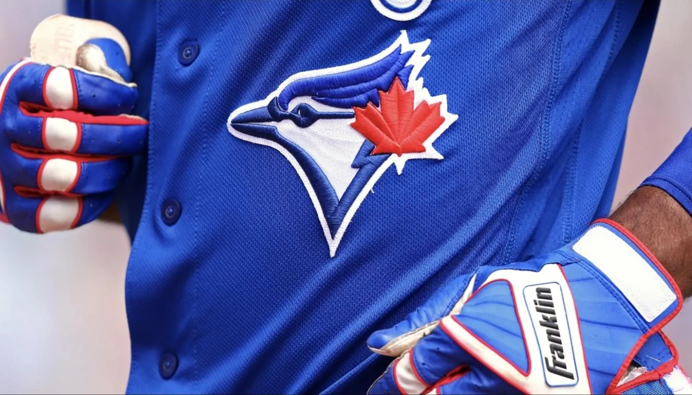 A view of the Toronto Blue Jays logo on an official Majestic game jersey. Rodolfo Castro.
