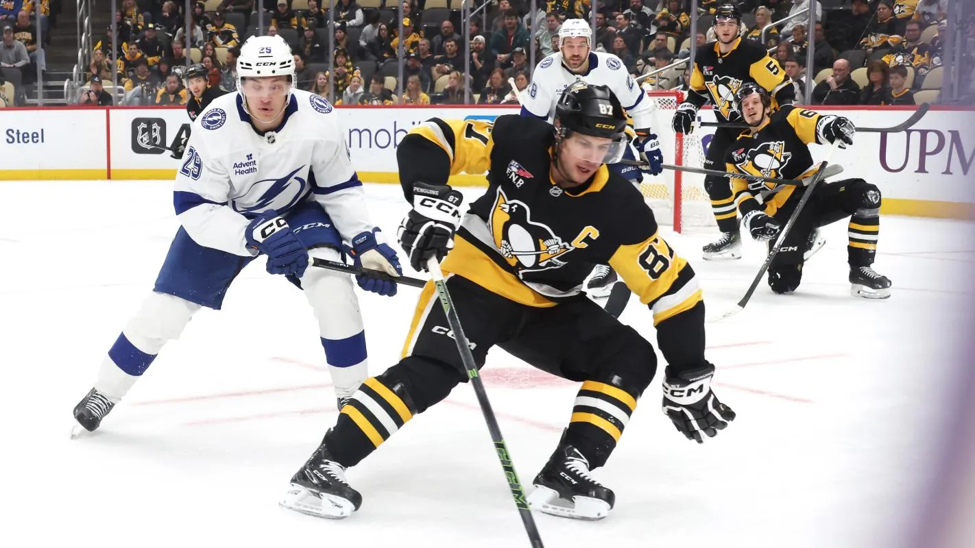 Pittsburgh Penguins center Sidney Crosby (87) handles the puck against Tampa Bay Lightning right wing Pontus Holmberg (29) during the second period at PPG Paints Arena.