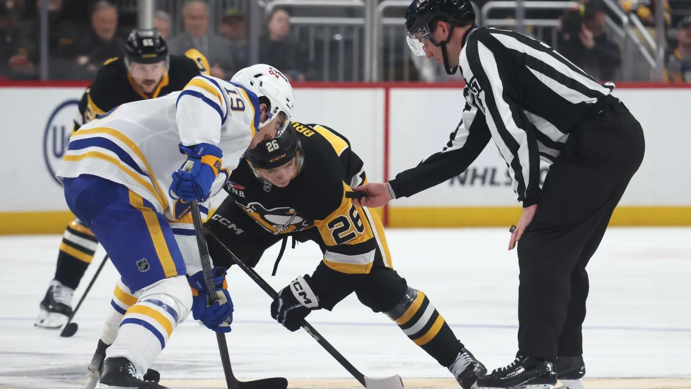 Buffalo Sabres center Peyton Krebs (19) and Pittsburgh Penguins center Tristan Broz (26) take a face-off during the third period at PPG Paints Arena.