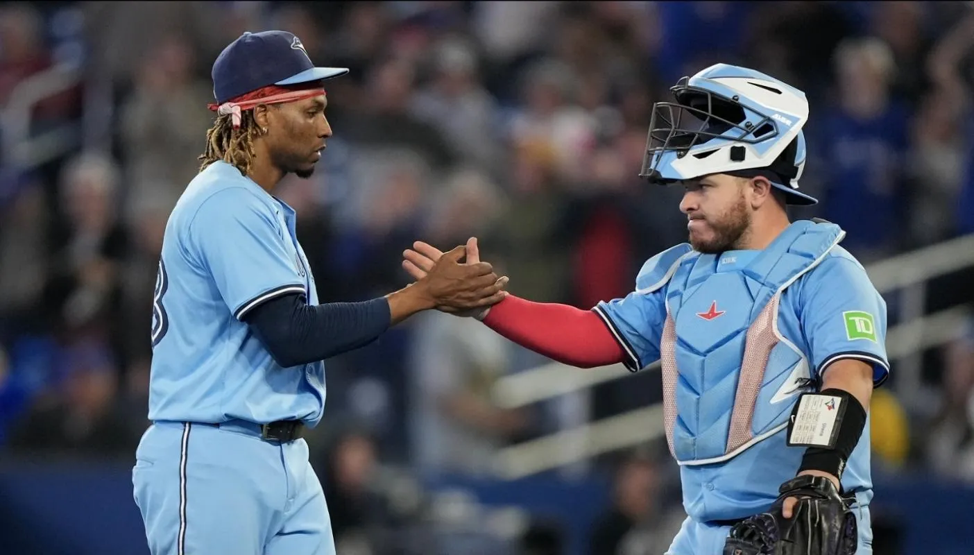 Toronto Blue Jays pitcher Jose Urena (48) and catcher Alejandro Kirk (30) celebrate a win over the Athletics at Rogers Centre.