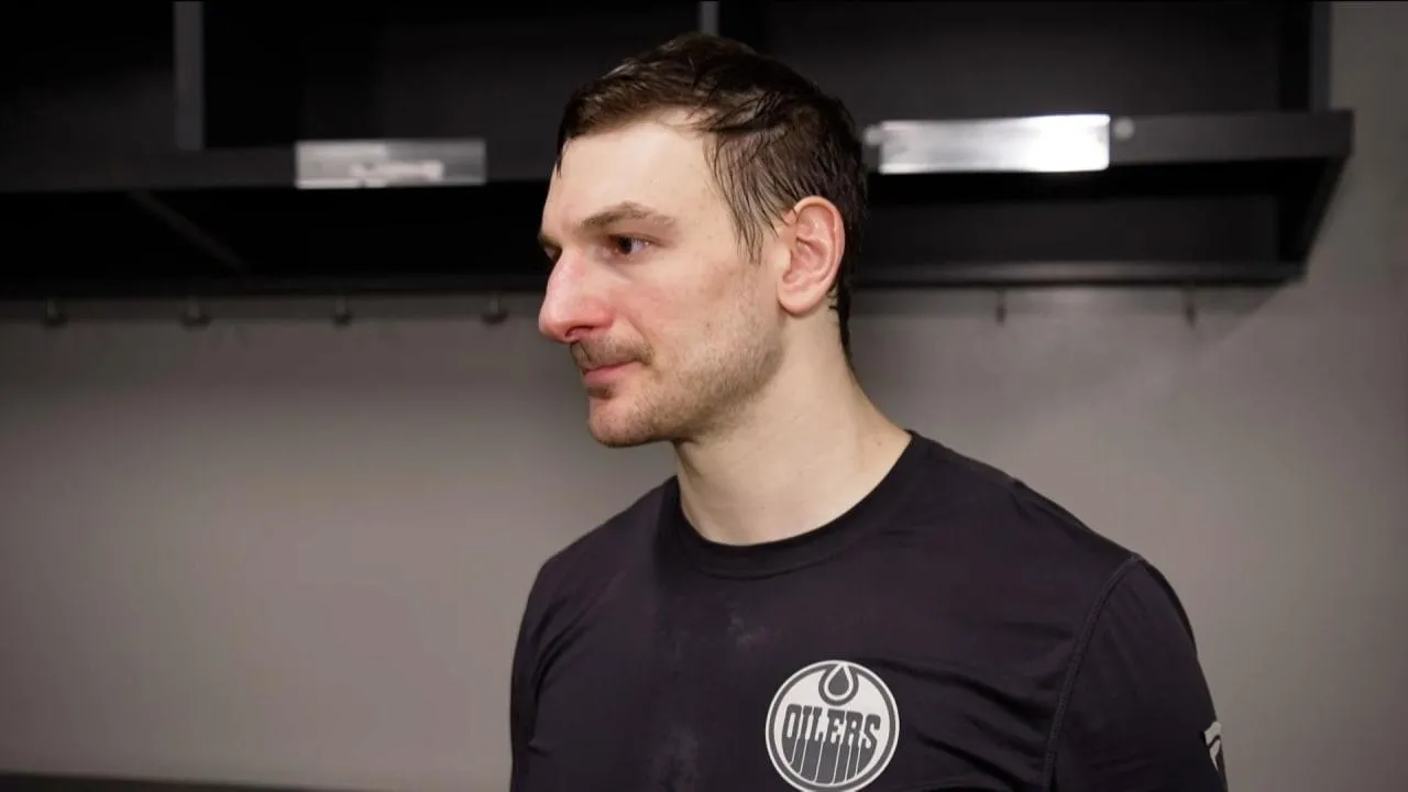 Edmonton Oilers' Zach Hyman speaks to reporters in the locker room