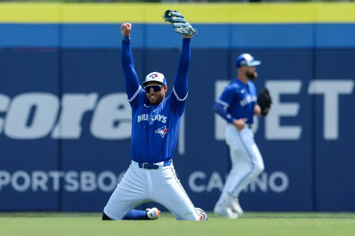 Toronto Blue Jays outfielder George Springer (4) celebrates after making a play against the Pittsburgh Pirates in the third inning during spring training at TD Ballpark.