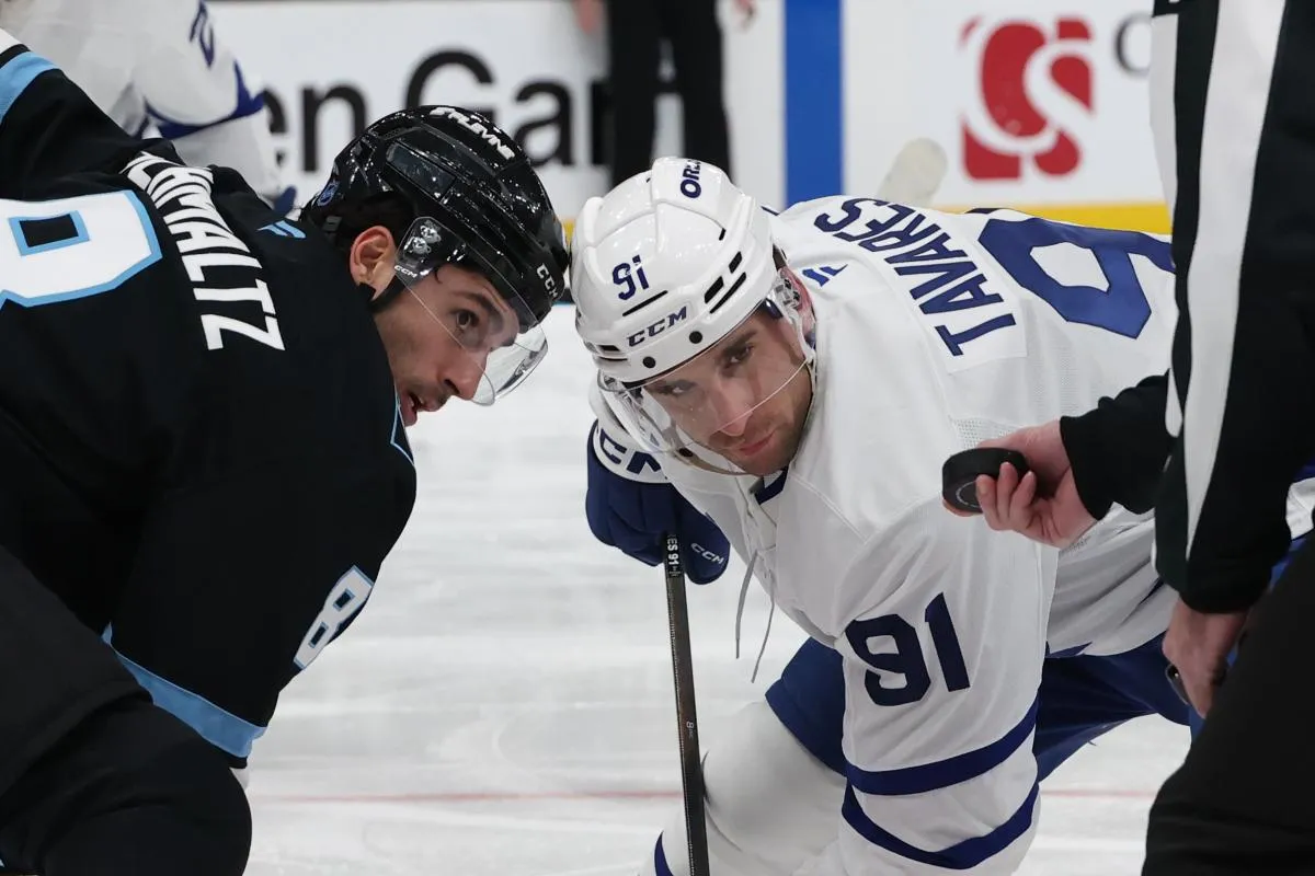 Utah Mammoth center Nick Schmaltz (8) and Toronto Maple Leafs center John Tavares (91) wait for a faceoff during the third period at Delta Center.