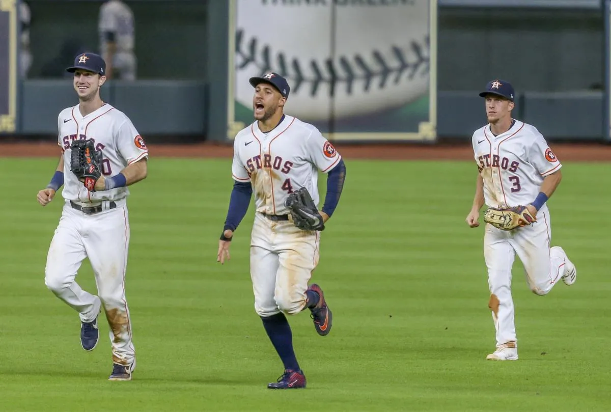 From left to right Houston Astros right fielder Kyle Tucker (30) and center fielder George Springer (4) and center fielder Myles Straw (3) celebrate the win over the Colorado Rockies at Minute Maid Park.