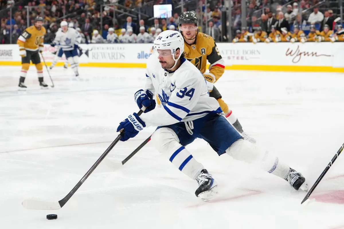 Toronto Maple Leafs center Auston Matthews (34) skates ahead of Vegas Golden Knights center Jack Eichel (9) during the third period at T-Mobile Arena.