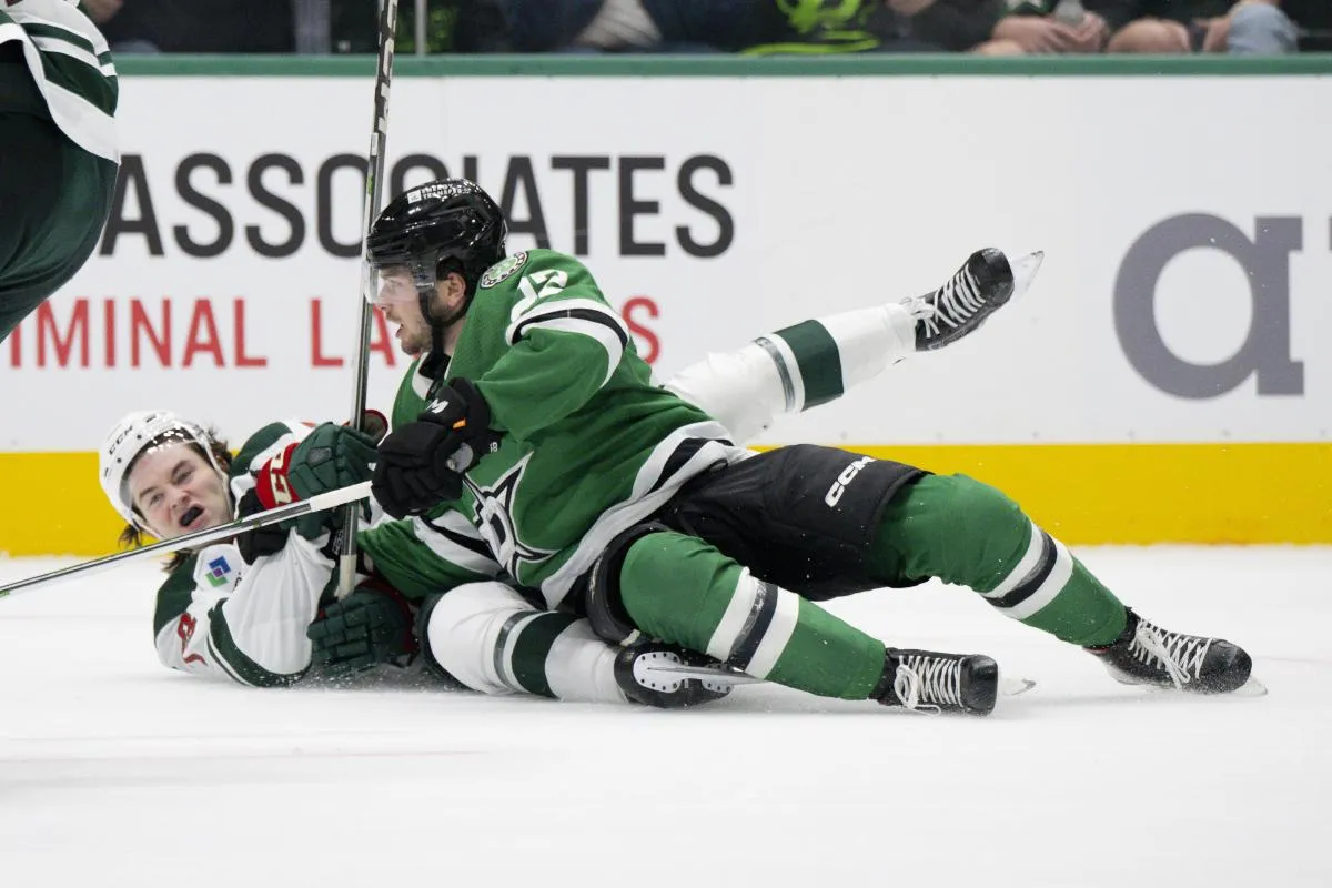 Minnesota Wild defenseman Kyle Masters (73) takes down Dallas Stars center Mavrik Bourque (22) during the second period at the American Airlines Center.