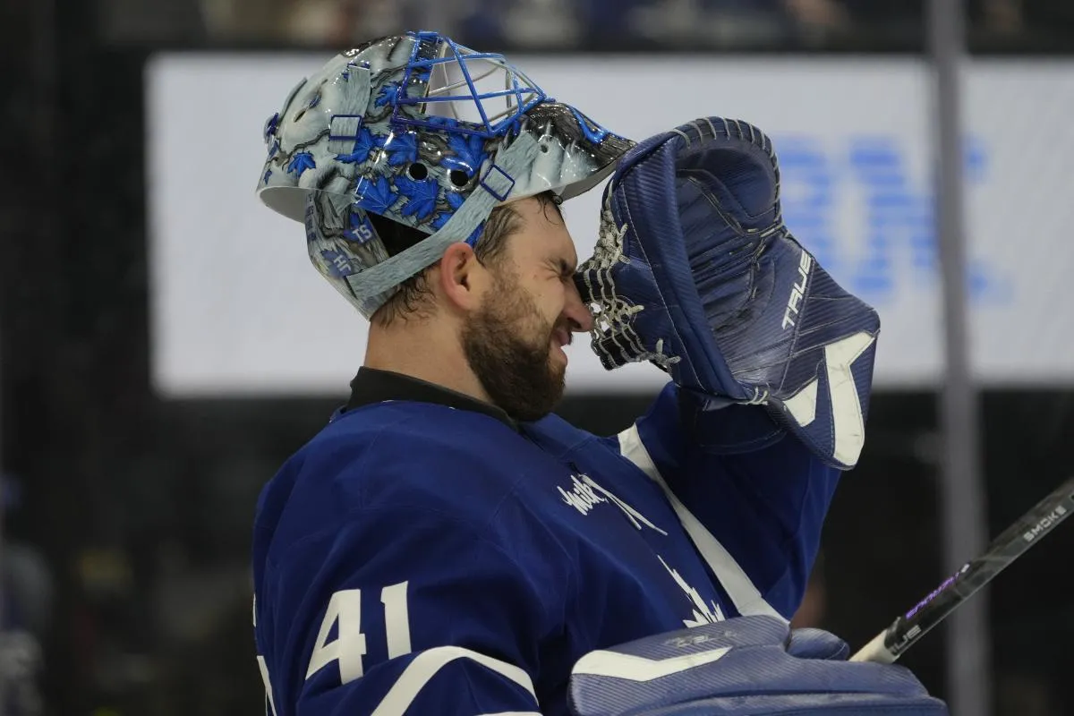 Toronto Maple Leafs goaltender Anthony Stolarz (41) winces during a break in the action against the Calgary Flames during the second period at Scotiabank Arena.