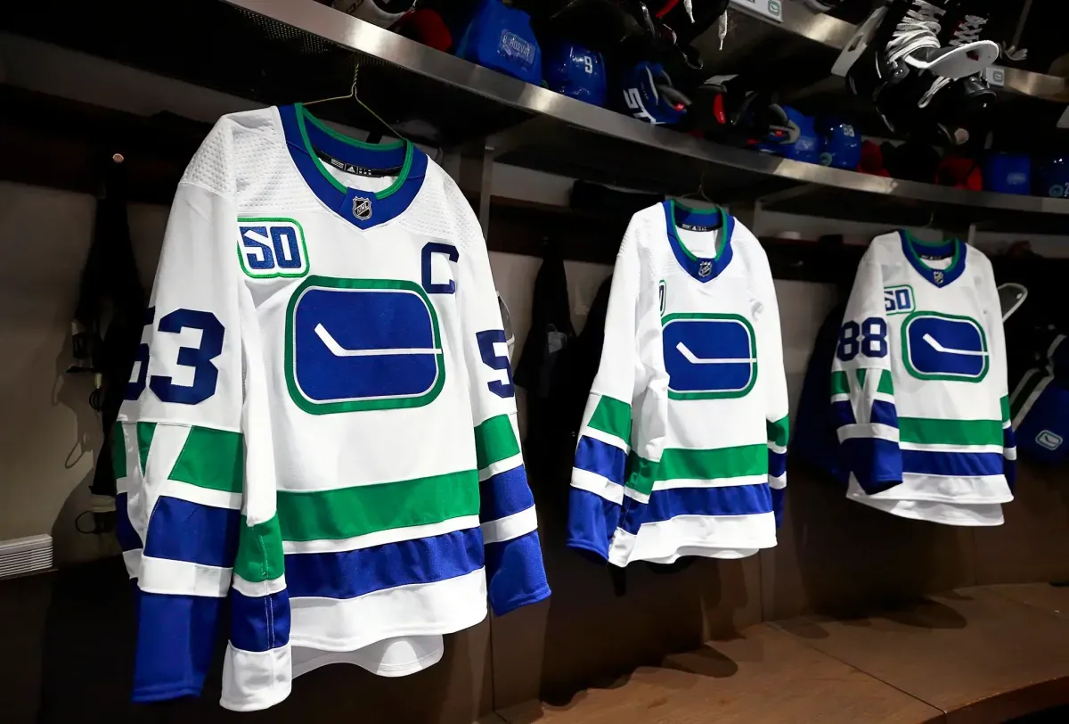 Vancouver Canucks stick in rink logo jerseys