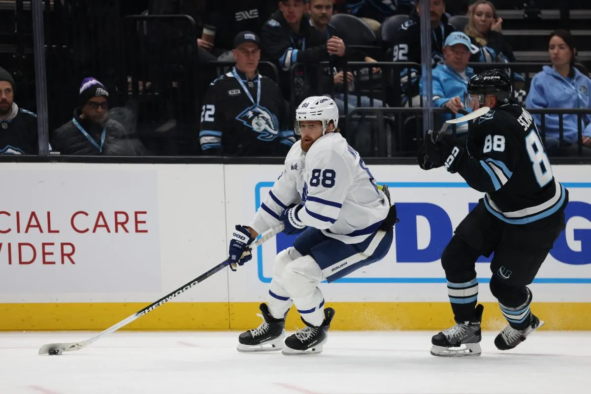 Toronto Maple Leafs right wing William Nylander (88) skates with the puck against Utah Mammoth defenseman Nate Schmidt (88) during the third period at Delta Center