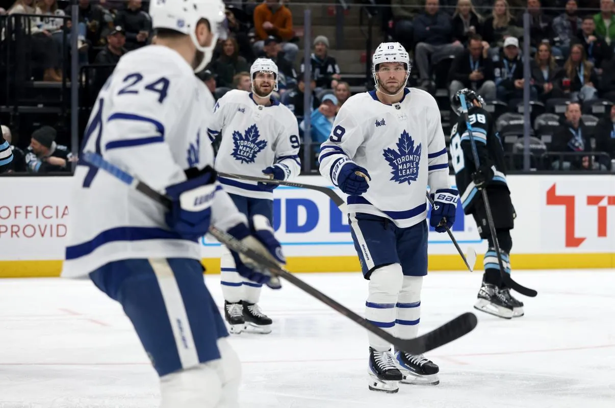 Toronto Maple Leafs center Calle Jarnkrok (19) celebrates with teammates after a goal against the Utah Mammoth during the third period at Delta Center.