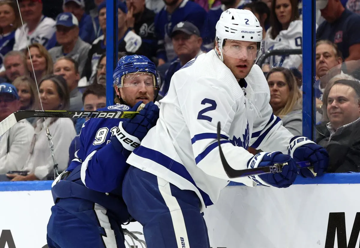 Tampa Bay Lightning center Steven Stamkos (91) and Toronto Maple Leafs defenseman Luke Schenn (2) fight to control the puck during the first period at Amalie Arena.