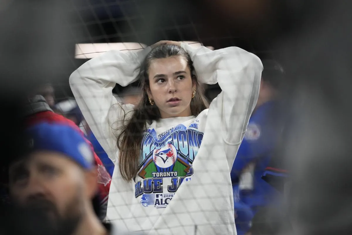 A fan looks on in the ninth inning between the Toronto Blue Jays and the Los Angeles Dodgers during game seven of the 2025 MLB World Series at Rogers Centre.
