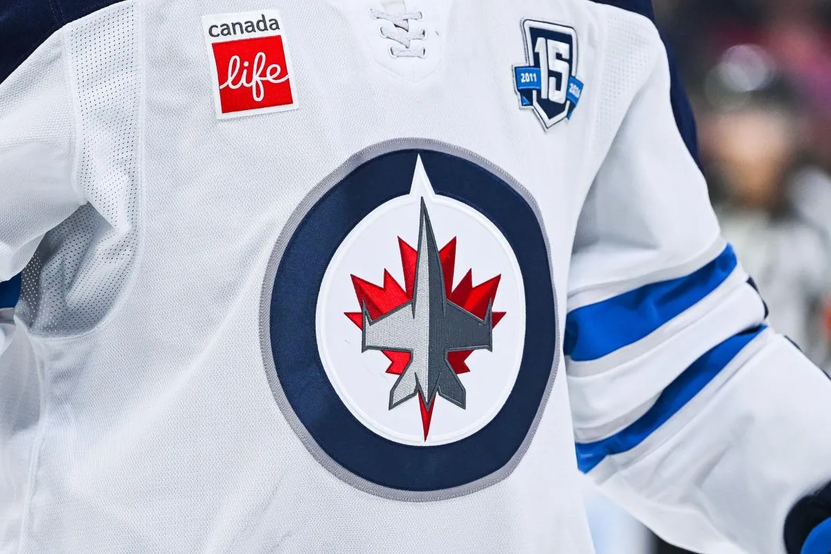 View of a Winnipeg Jets logo on a jersey worn by a member of the team during the first period at Bell Centre.