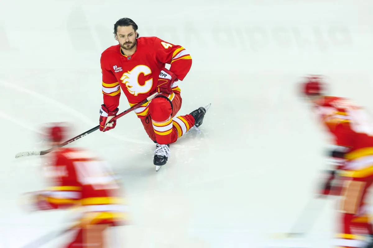 Calgary Flames defenseman Rasmus Andersson (4) during the warmup period against the New York Islanders at Scotiabank Saddledome.