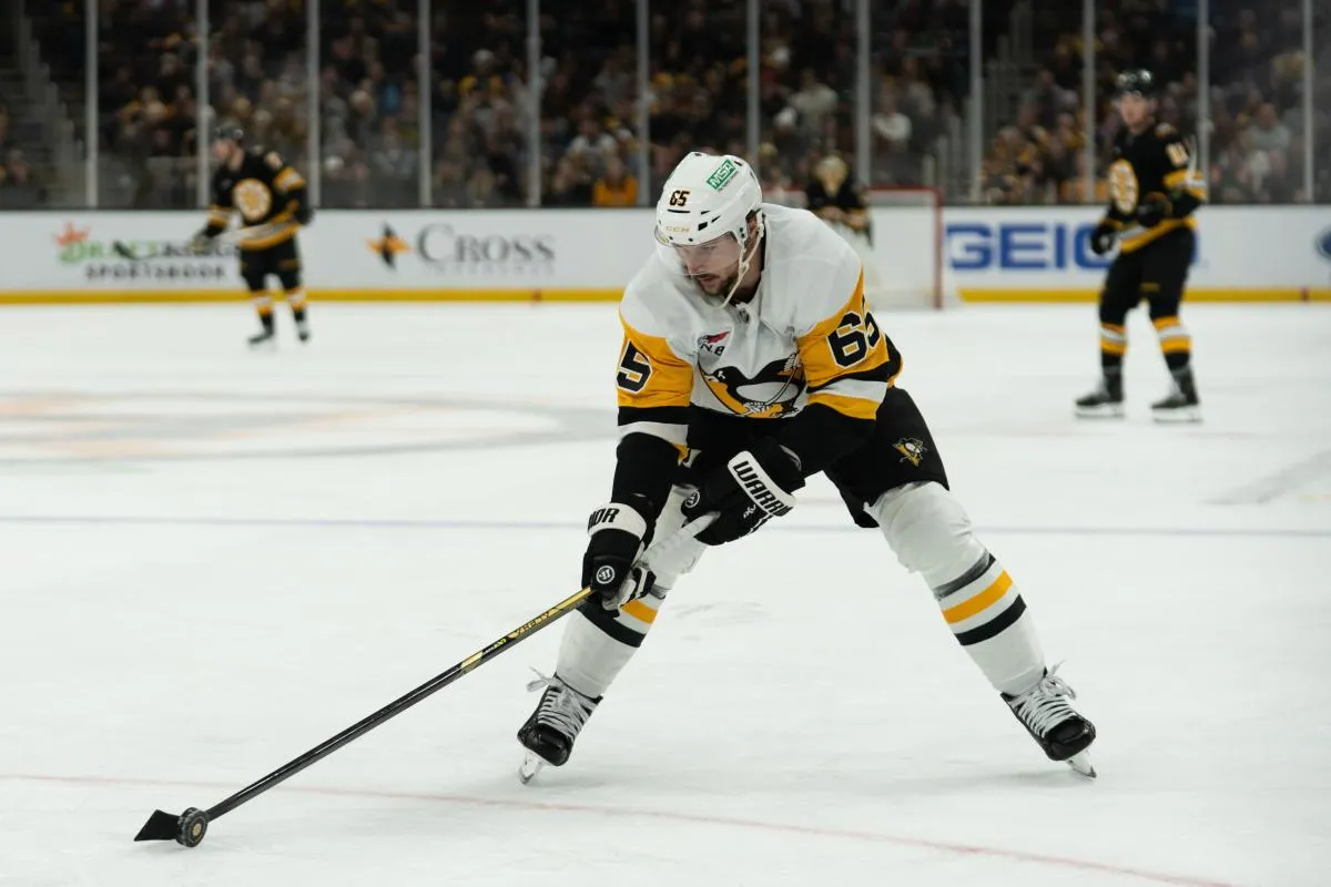 Pittsburgh Penguins defenseman Erik Karlsson (65) skates with the puck during the first period of the game against the Boston Bruins at TD Garden.