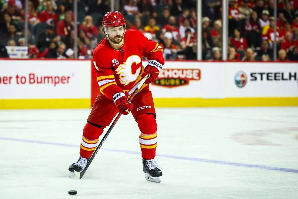 Calgary Flames defenseman Rasmus Andersson (4) controls the puck against the Philadelphia Flyers during the second period at Scotiabank Saddledome.