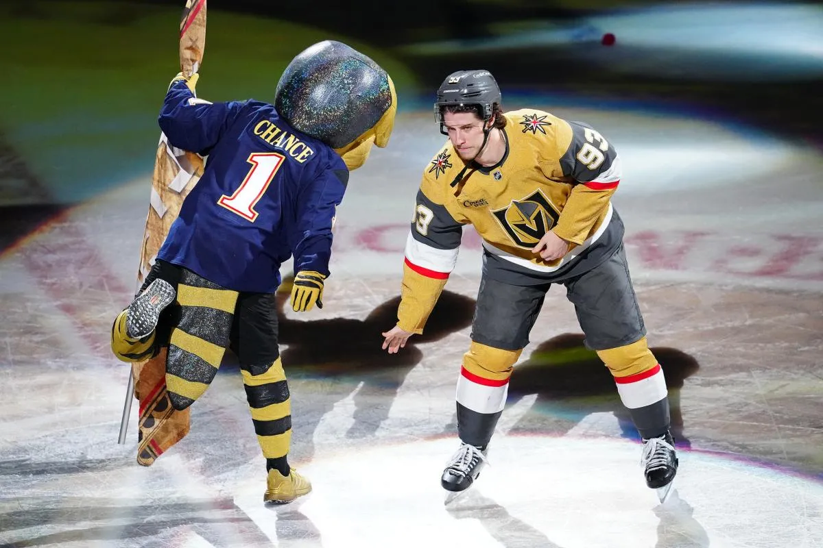 Vegas Golden Knights right wing Mitch Marner (93) celebrates with Golden Knights mascot Chance after the Golden Knights defeated the Nashville Predators 7-2 at T-Mobile Arena.
