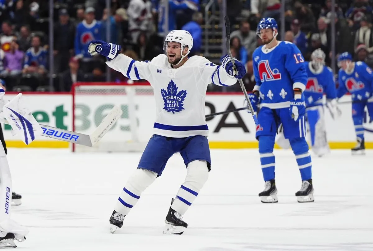 Toronto Maple Leafs center Scott Laughton (24) celebrates defeating the Colorado Avalanche in overtime at Ball Arena.