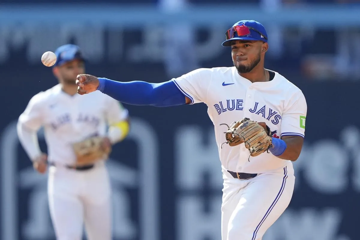 Toronto Blue Jays second baseman Leo Jimenez (49) throws to first base against Los Angeles Angels during the ninth inning at Rogers Centre.
