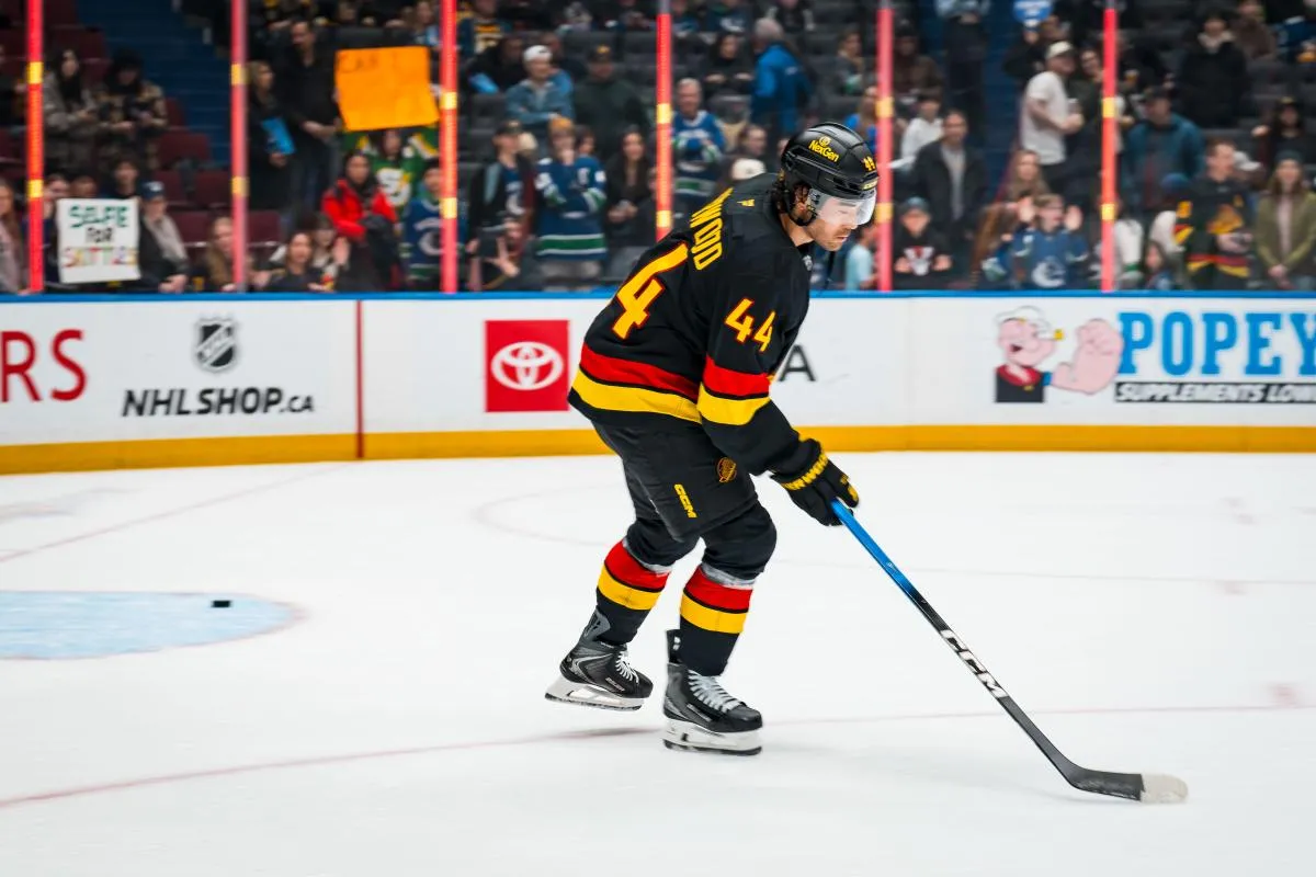 Vancouver Canucks forward Kiefer Sherwood (44) handles the puck in warm up prior to a game against the Boston Bruins at Rogers Arena.
