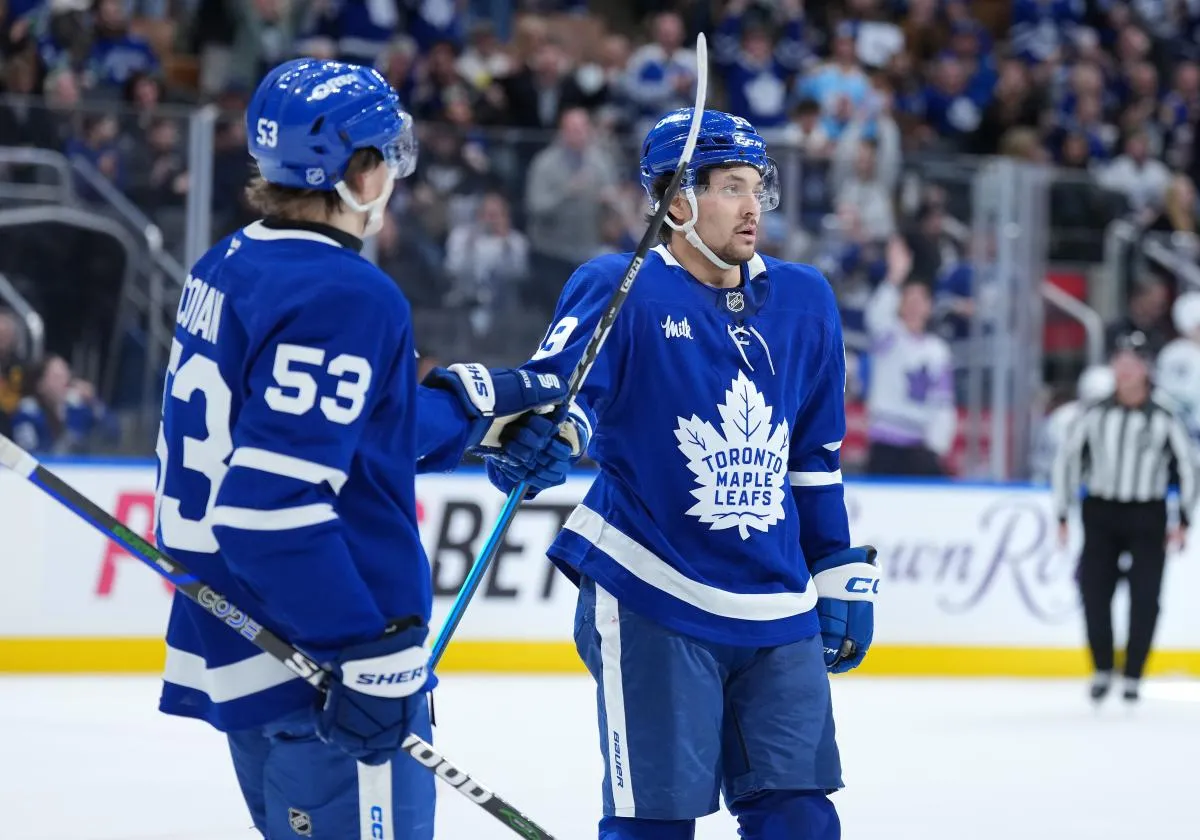 Toronto Maple Leafs left wing Nicholas Robertson (89) scores a goal and celebrates with right wing Easton Cowan (53) against the Vancouver Canucks during the third period at Scotiabank Arena.