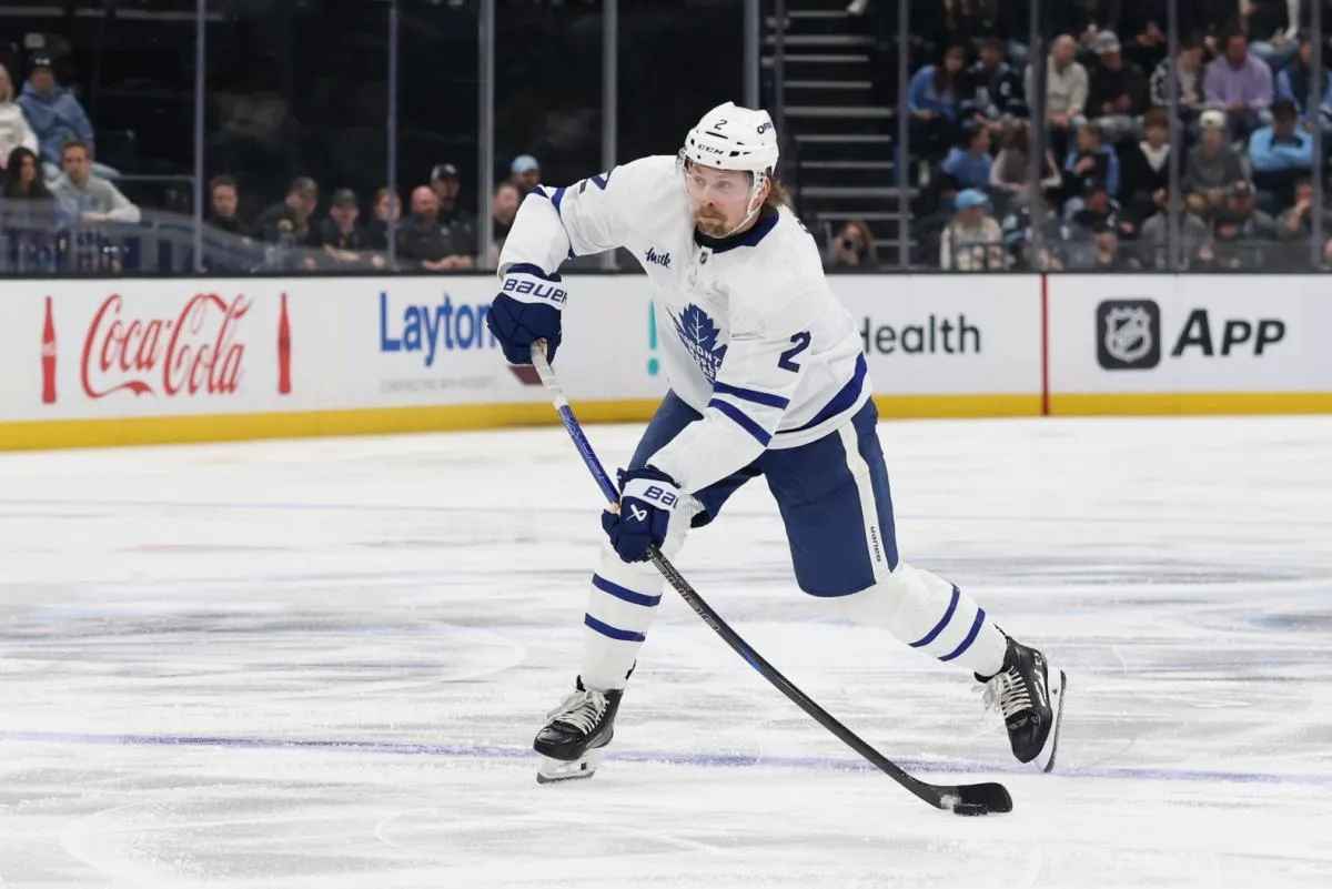 Toronto Maple Leafs defenseman Simon Benoit (2) shoots against the Utah Mammoth during the first period at Delta Center.