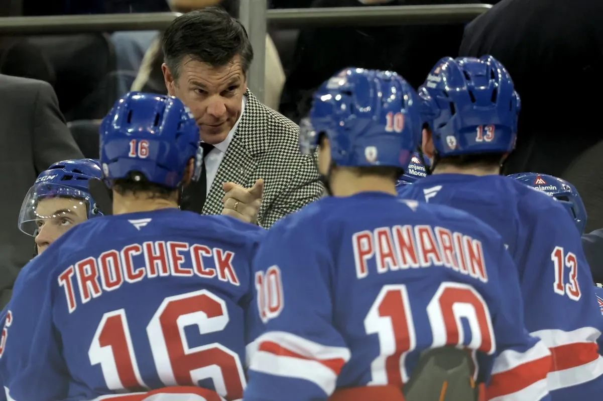 New York Rangers head coach Mike Sullivan talks to center Vincent Trocheck (16) and left wings Artemi Panarin (10) and Alexis Lafreniere (13) during a time out during the third period against the Utah Mammoth at Madison Square Garden.