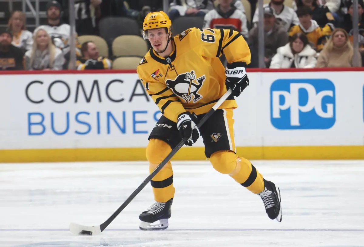 Pittsburgh Penguins right wing Rickard Rakell (67) skates with the puck against the Philadelphia Flyers during the third period at PPG Paints Arena.
