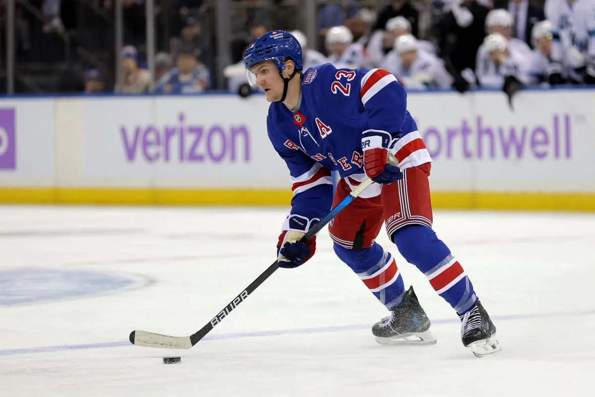 New York Rangers defenseman Adam Fox (23) skates with the puck against the Utah Mammoth during the second period at Madison Square Garden.