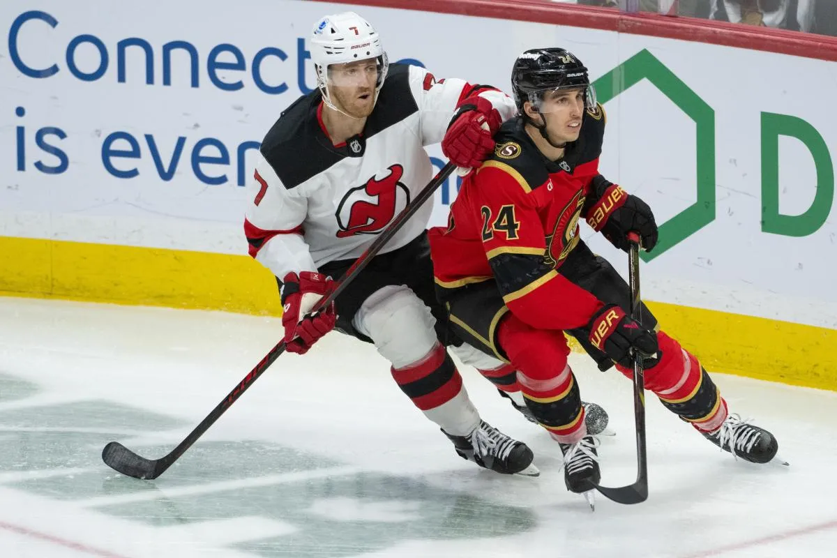 New Jersey Devils defenseman Dougie Hamilton (7) and Ottawa Senators center Dylan Cozens (24) follow the puck in the third period at the Canadian Tire Centre.
