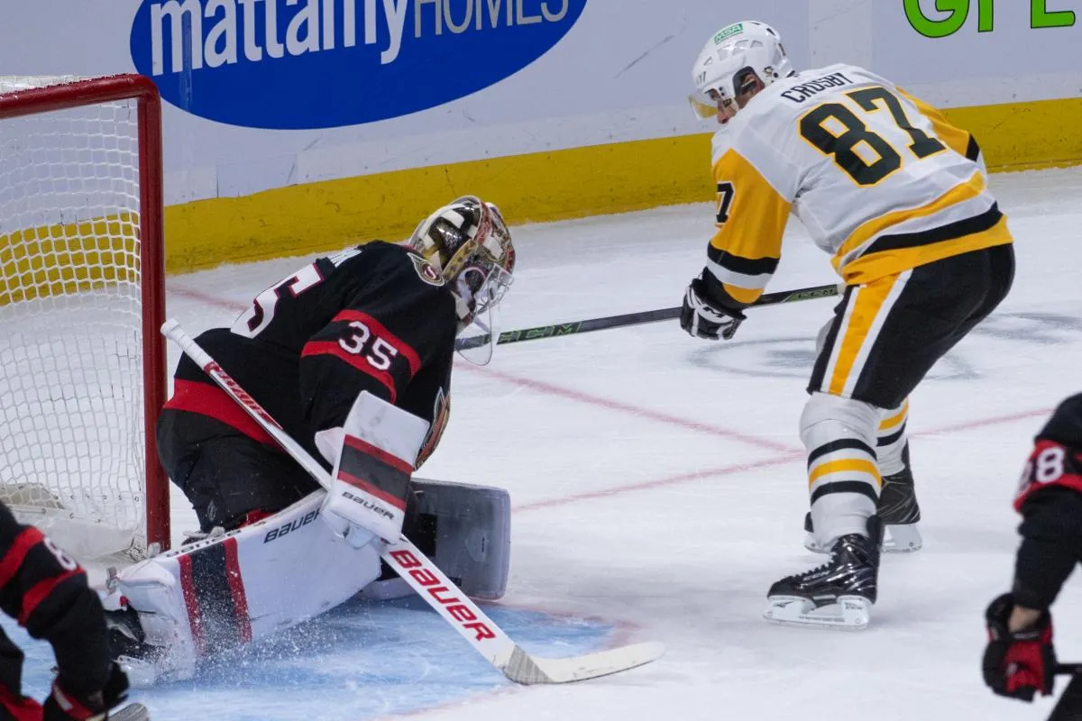 Ottawa Senators goalie Linus Ullmark (35) makes a save on a shot from Pittsburgh Penguins center Sidney Crosby (97) in the third period at the Canadian Tire Centre.