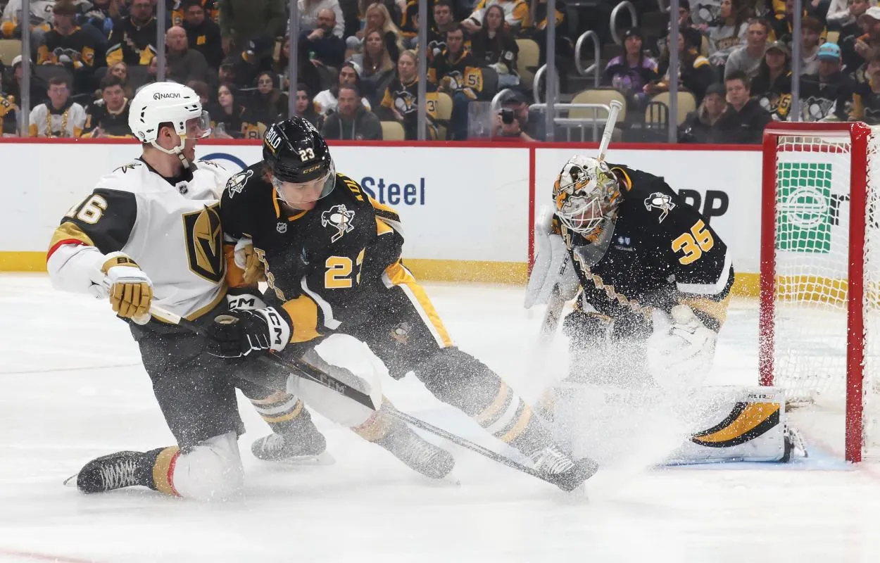 Pittsburgh Penguins goaltender Tristan Jarry (35) makes a save against the Vegas Golden Knights left wing Pavel Dorofeyev (16) as Penguins defenseman Vladislav Kolyachonok (23) defends during the second period at PPG Paints Arena.