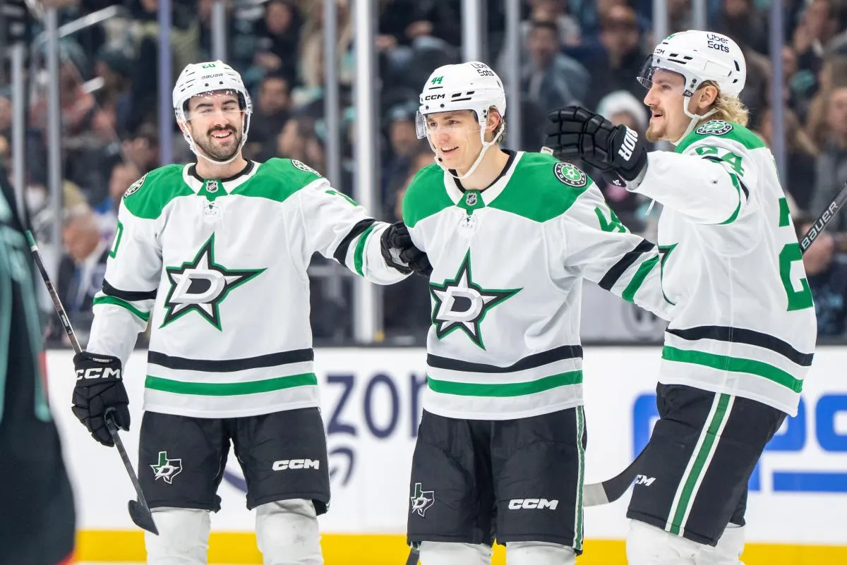 Dallas Stars, from left, defenseman Kyle Capobianco (20), defenseman Vladislav Kolyachonok (44) and forward Roope Hintz (24) celebrate a goal during the third period at Climate Pledge Arena.