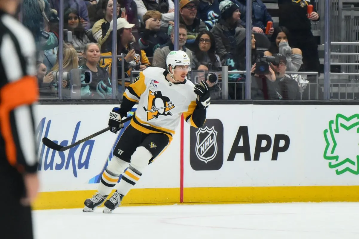 Pittsburgh Penguins center Connor Dewar (19) celebrates after scoring a goal against the Seattle Kraken during the first period at Climate Pledge Arena.