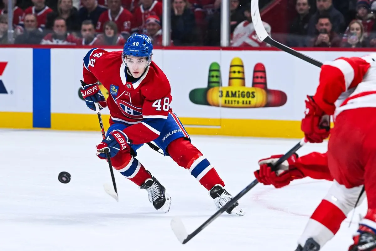 Montreal Canadiens defenseman Lane Hutson (48) plays the puck against the Detroit Red Wings during the first period at Bell Centre.