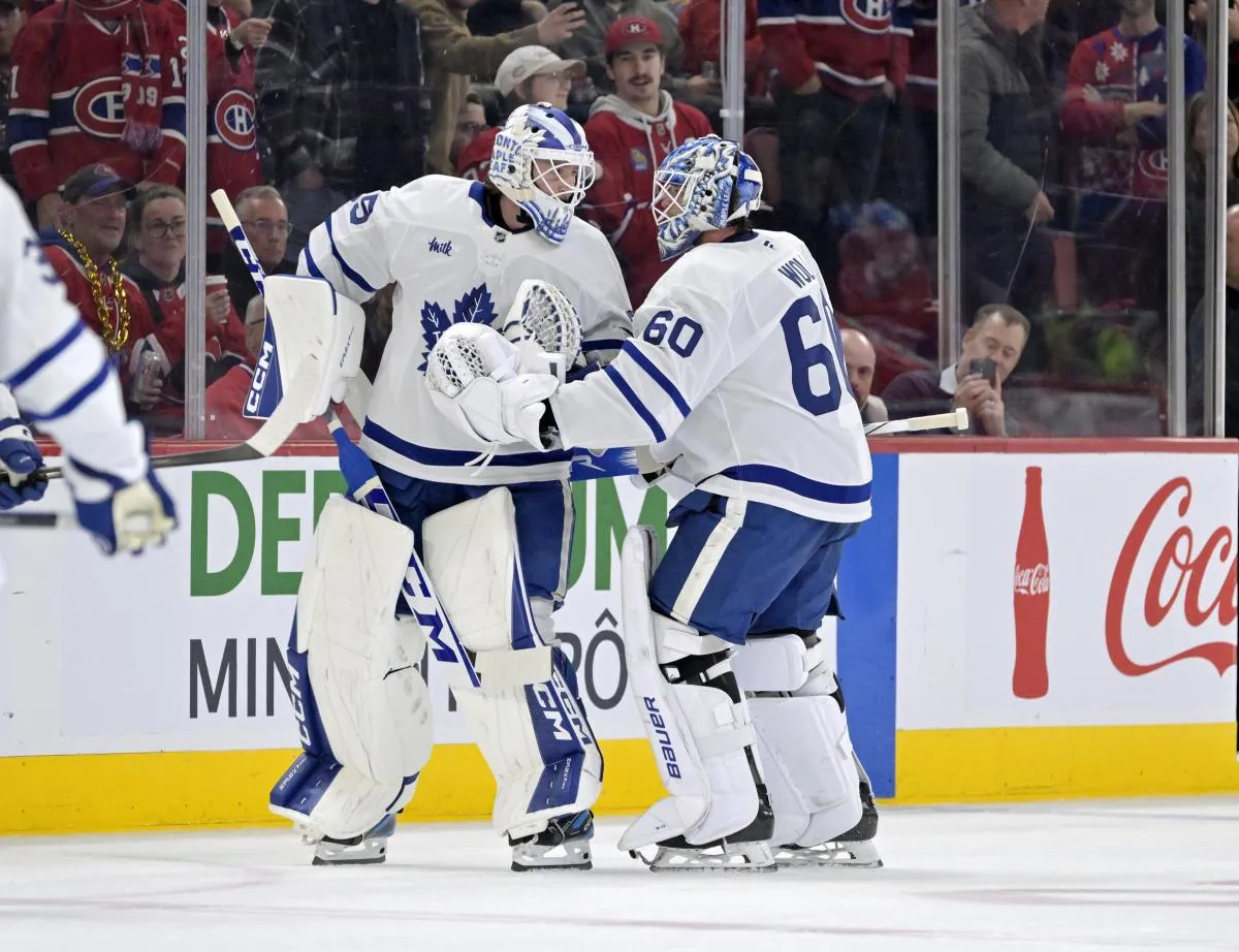 Toronto Maple Leafs goalie Dennis Hildeby (35) comes in to relieve teammate goalie Joseph Woll (60) during the second period of the game against the Montreal Canadiens at the Bell Centre.