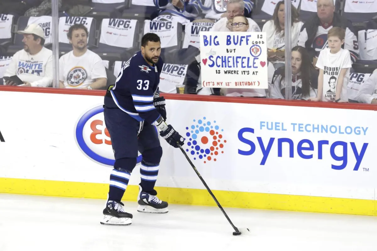 Winnipeg Jets defenseman Dustin Byfuglien (33) skates past fans prior to the game against the St. Louis Blues in game one of the first round of the 2019 Stanley Cup Playoffs at Bell MTS Place.