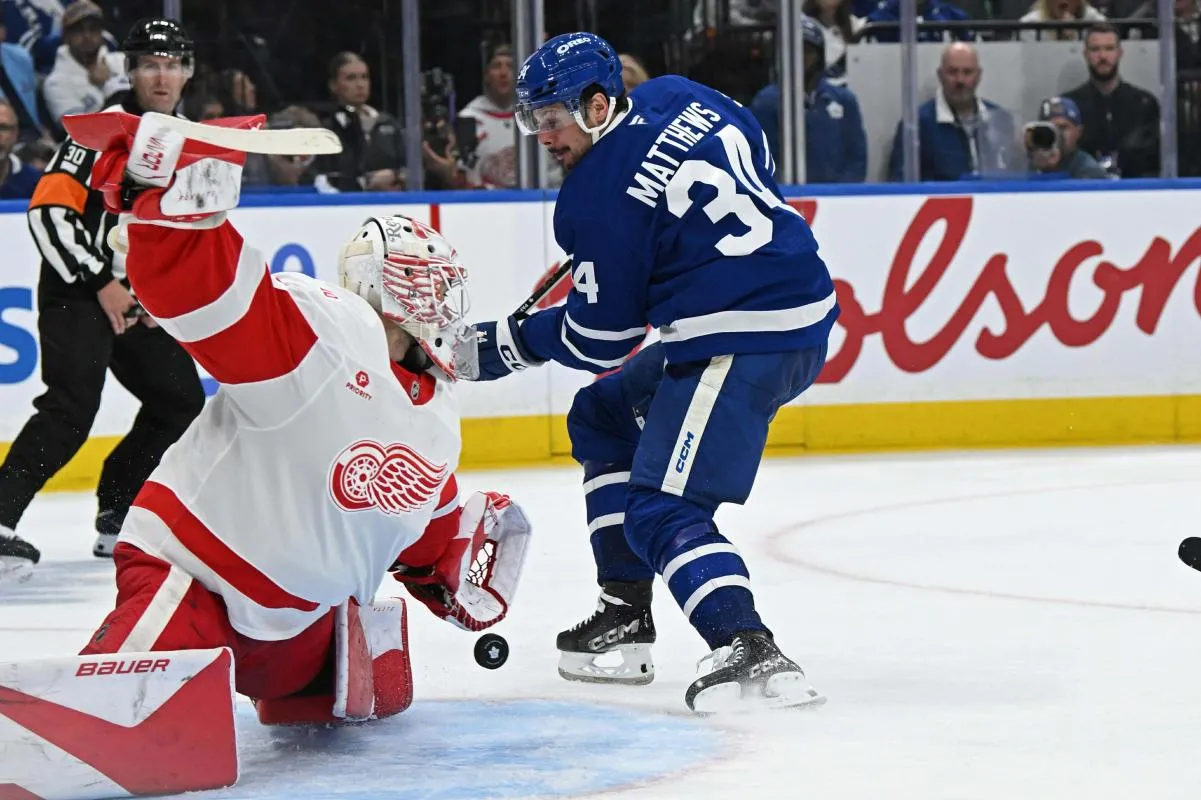 Detroit Red Wings goalie Cameron Talbot (39) makes a save on Toronto Maple Leafs center Auston Matthews (34) in the third period at Scotiabank Arena.