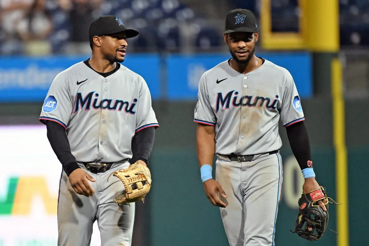Miami Marlins shortstop Xavier Edwards (9) and second base Otto Lopez (6) celebrate win against the Philadelphia Phillies at Citizens Bank Park.