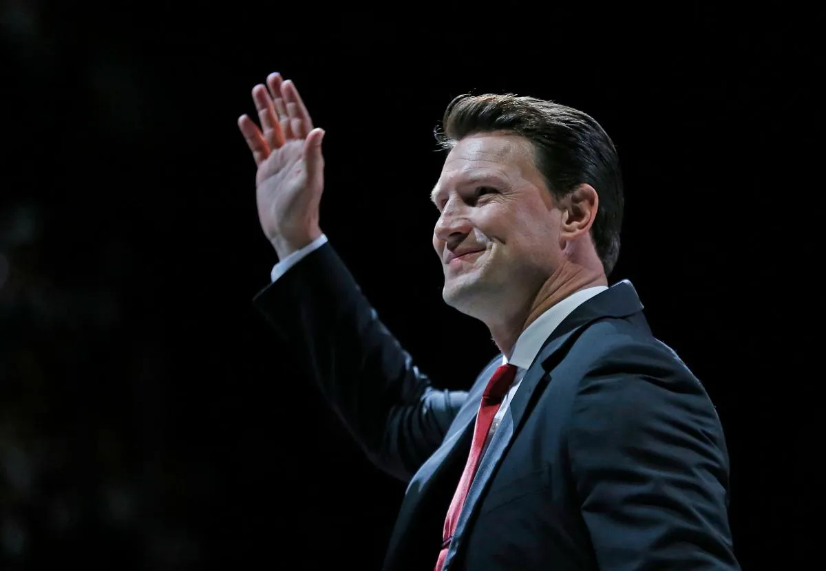 Shane Doan waves to fans as they clap after his jersey was raised during the jersey retirement ceremony at Gila River Arena in Glendale, Ariz. on February 24, 2019