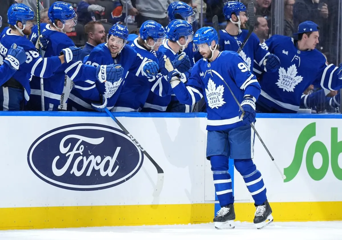 Toronto Maple Leafs defenseman Oliver Ekman-Larsson (95) celebrates at the bench after scoring a goal against the Edmonton Oilers during the second period at Scotiabank Arena.