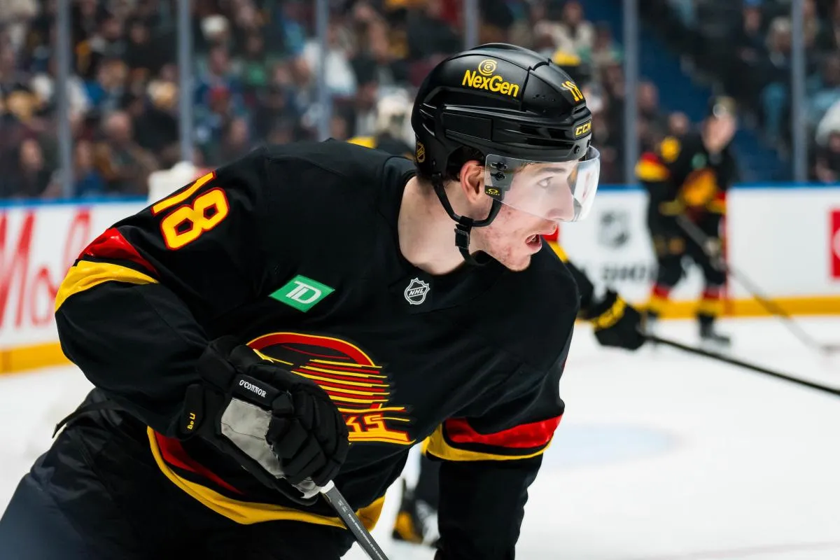 Vancouver Canucks forward Drew O'Connor (18) skates against the Boston Bruins in the first period at Rogers Arena.