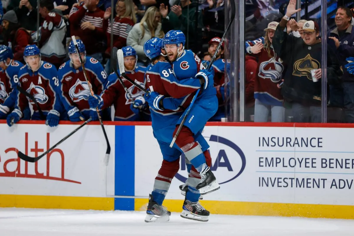Colorado Avalanche defenseman Ilya Solovyov (28) celebrates his goal with defenseman Brent Burns (84) in the second period against the Columbus Blue Jackets at Ball Arena.